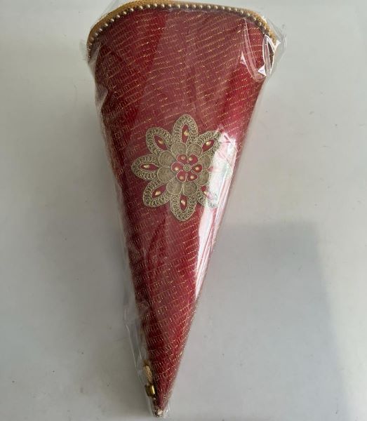 Decorated empty cone to be filled with sweets or sugar and exchanged by the bride and the groom during the engagement ceremony.