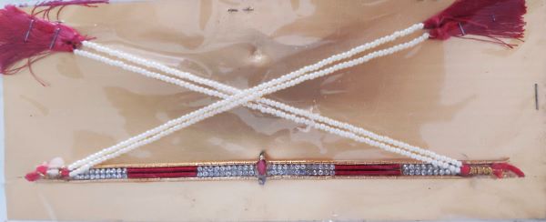 Decorative string of pearls to be tied on the forehead of the bride and groom during wedding ceremony.