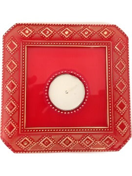 Plate with haldi kumkum and diya used to perform aarati.