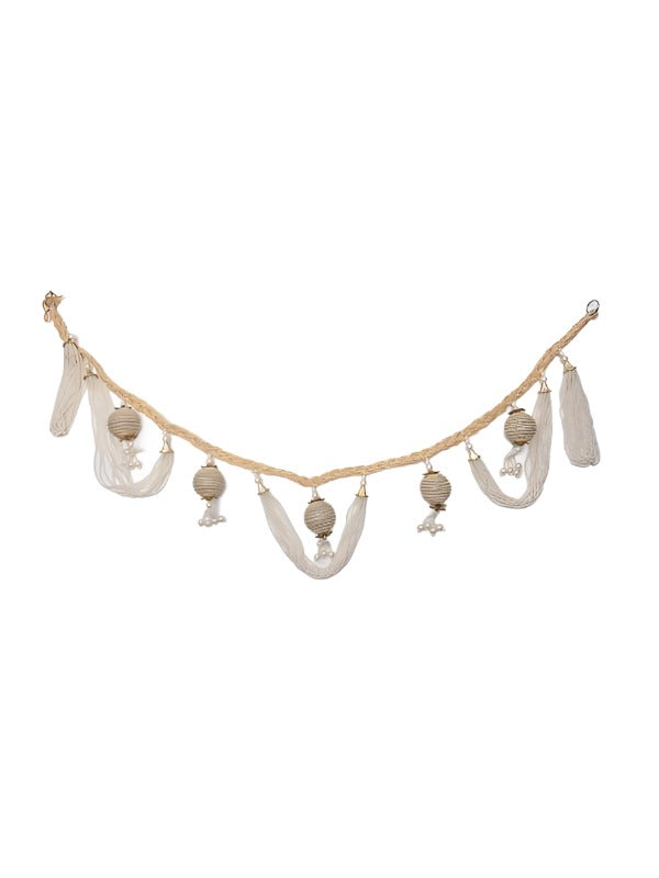 A decorated string tied at the main entrance as a sign of auspicious function.